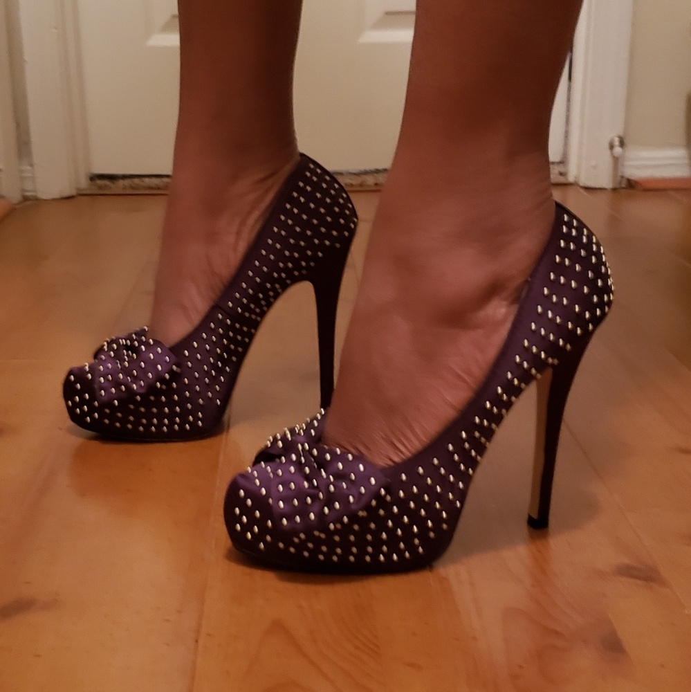 Plum gold studded bow tie platform heels.